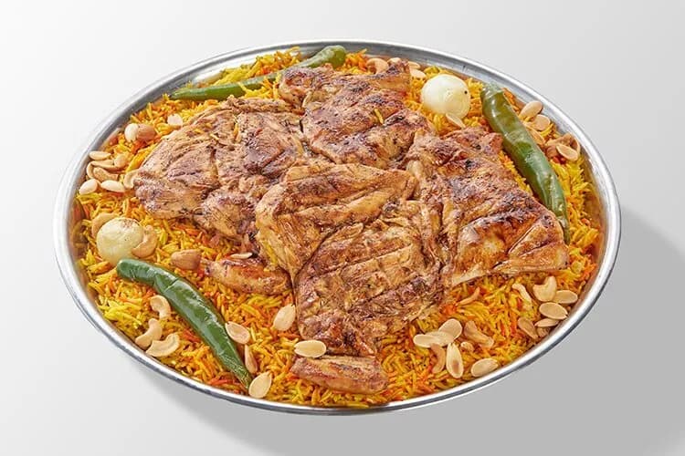 منسف فرخه مشويه شوايه مع ارز بالمكسرات